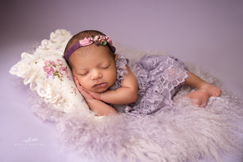 a sidelying newborn pose in shades of lavender during a nj newborn photo session