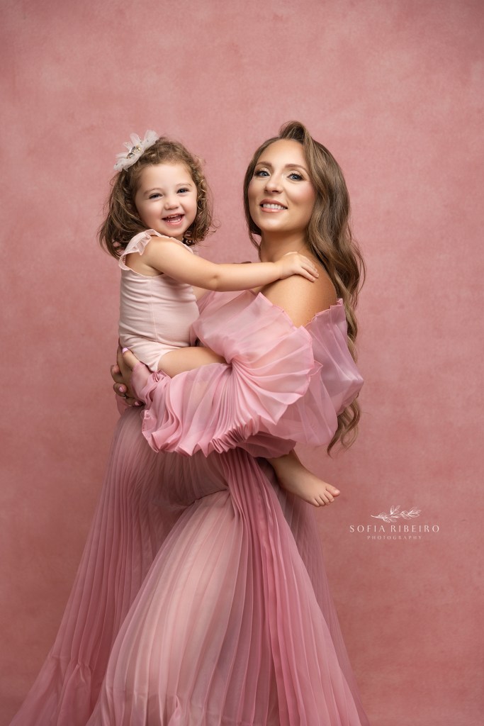 a sweet moment between mom and baby girl before new baby arrives