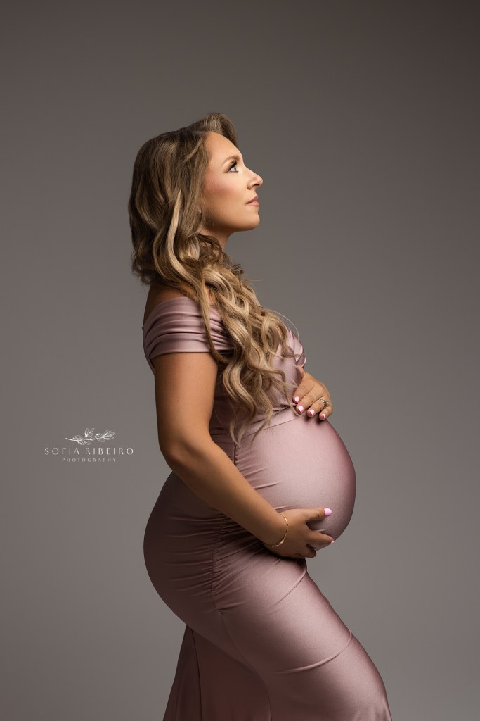 a simple portrait against a grey backdrop