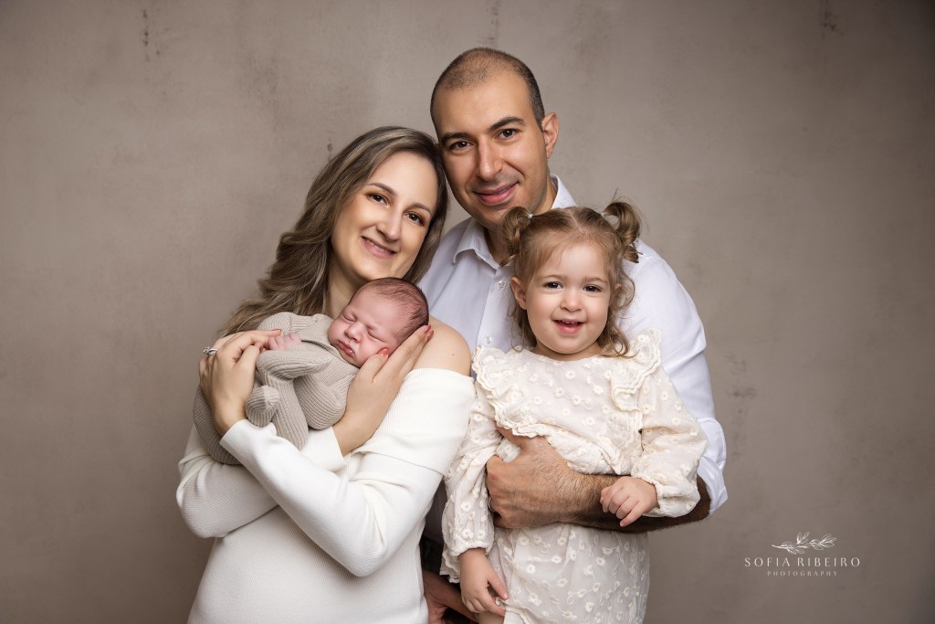 nj newborn photographer captures baby with parents in first photos together as a family