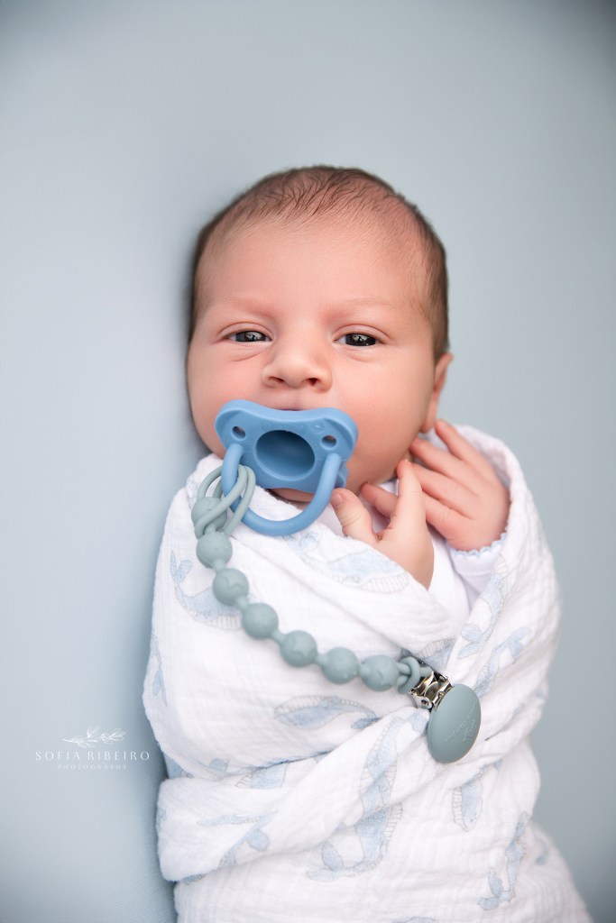 newborn baby boy wrapped in hospital swaddle