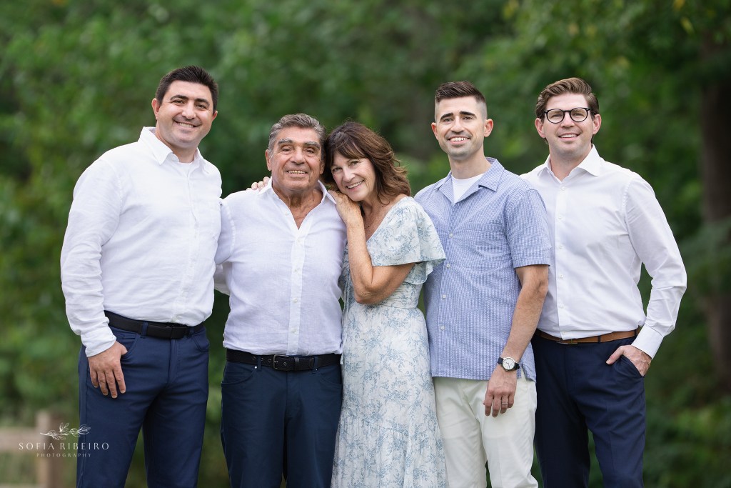 parents surrounded by three of their adult sons