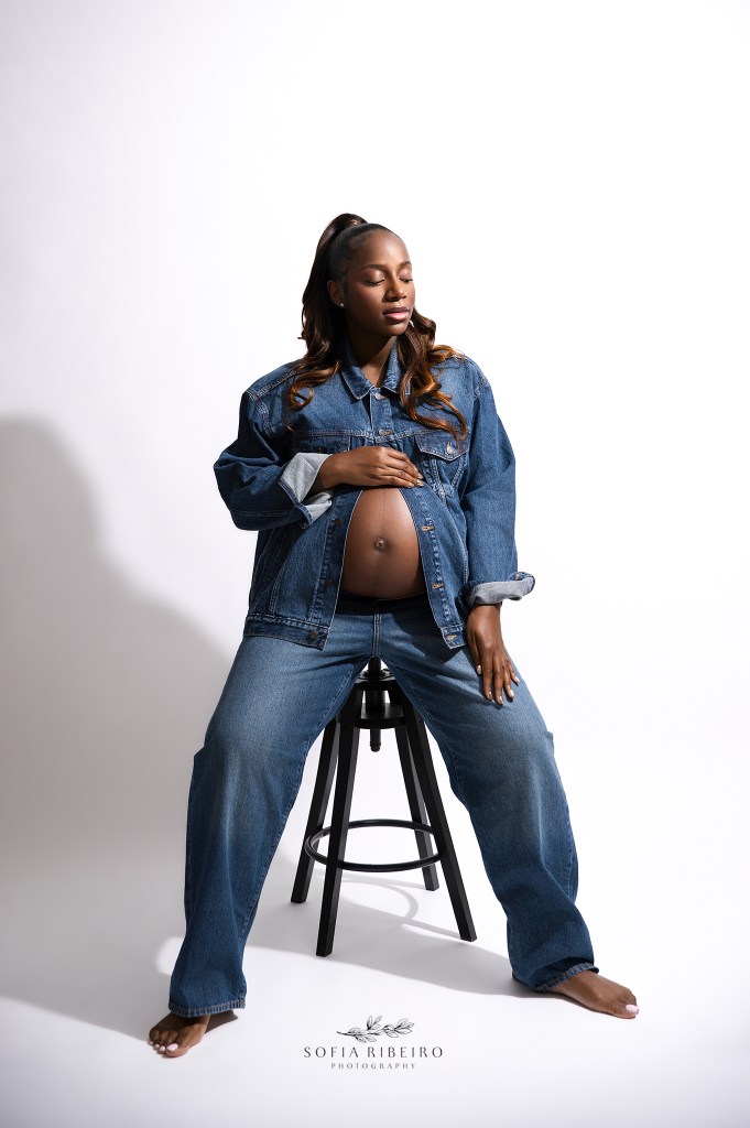 an editorial baby bump pose in denim by nj maternity photographer